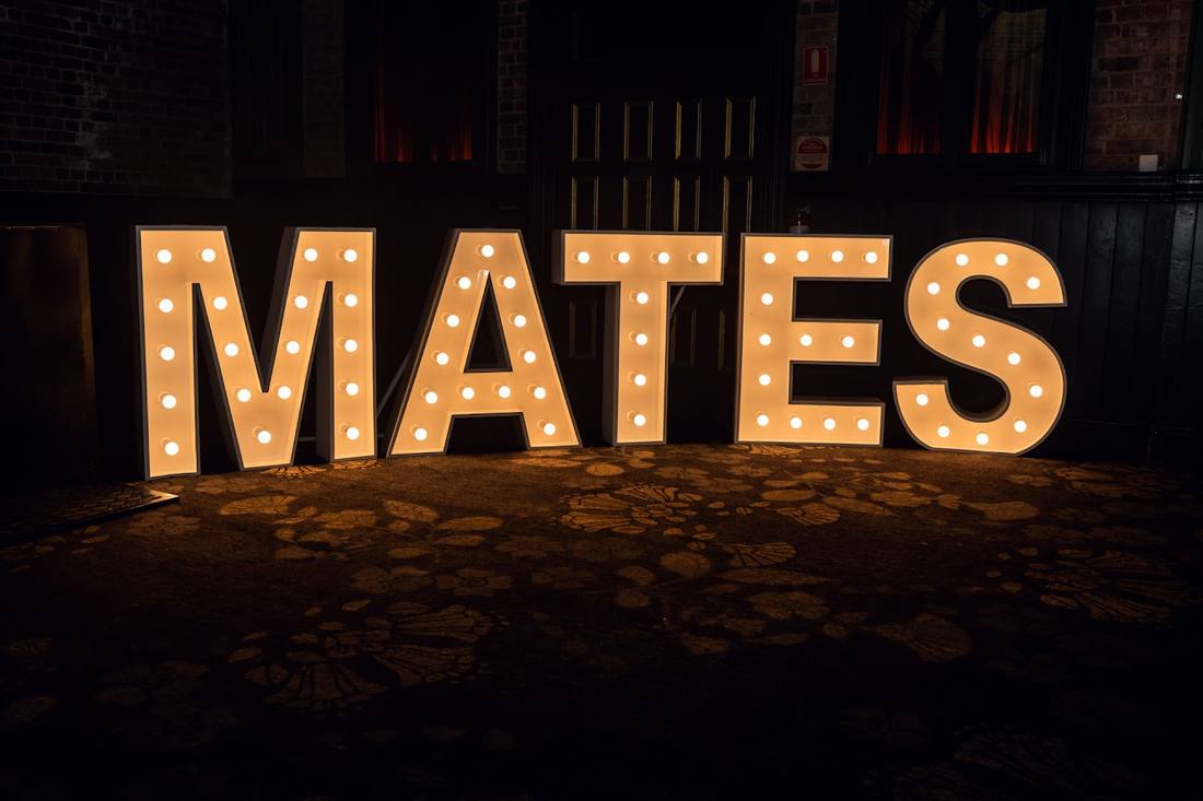 The MATES marquee letters lit up at the Ball